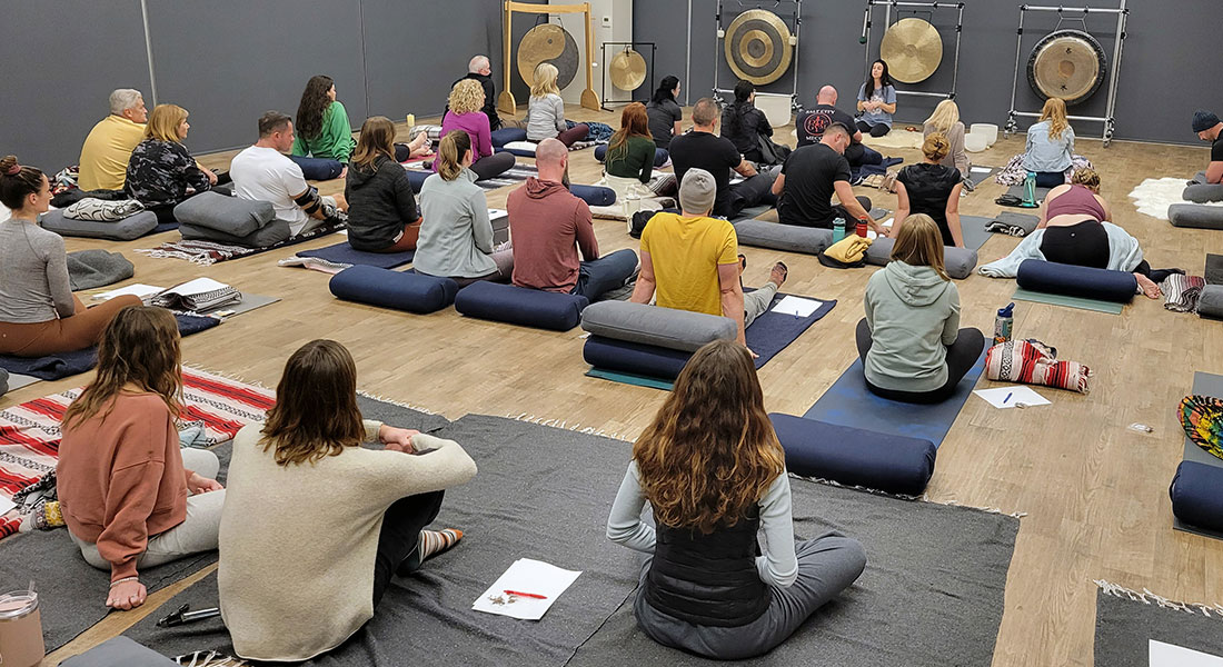 Breathwork community gathered in a circle